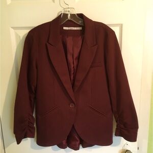 Burgundy blazer. Size L but fits med. ruched sleeves. Flattering Skirted back. 8